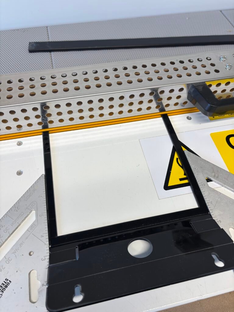 the heat bender in use, heating up a black piece of Perspex